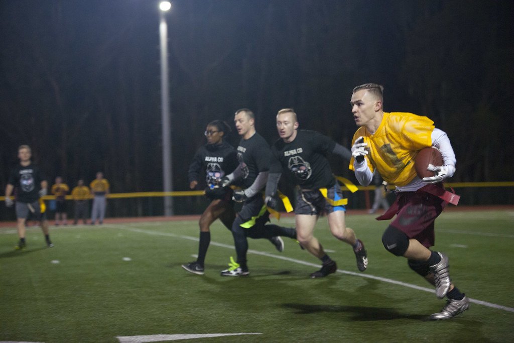 Young men playing flag football