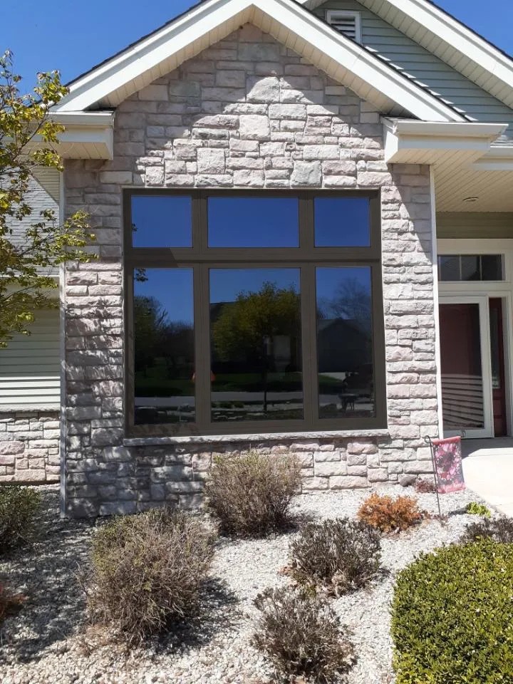 Exterior window replacement stone home