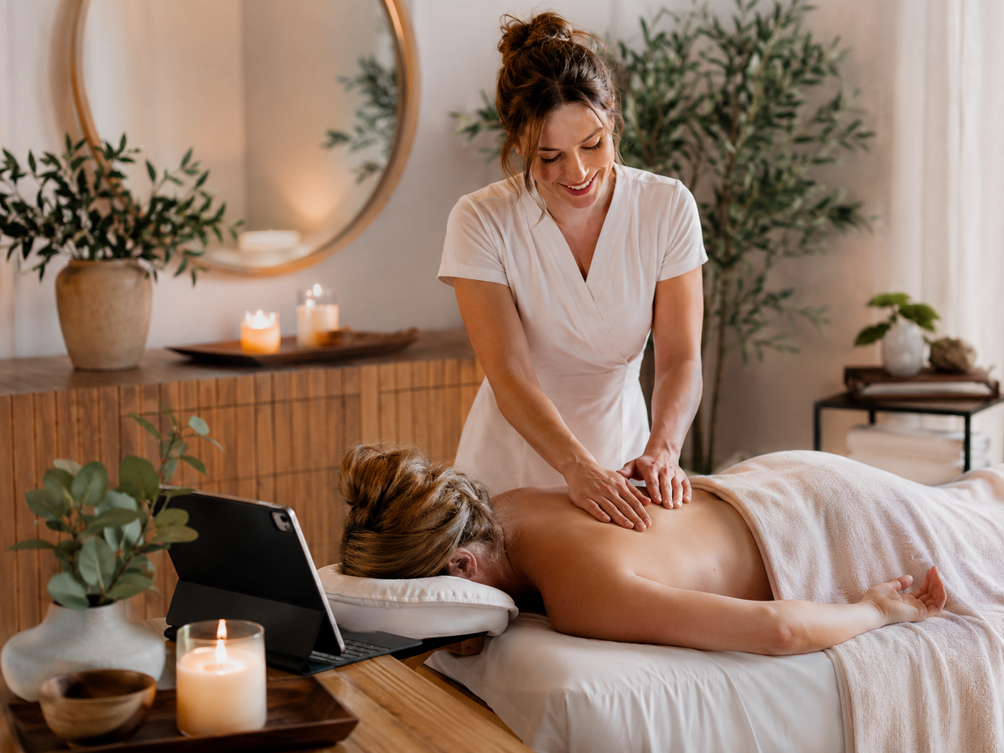Massage therapist working with a client