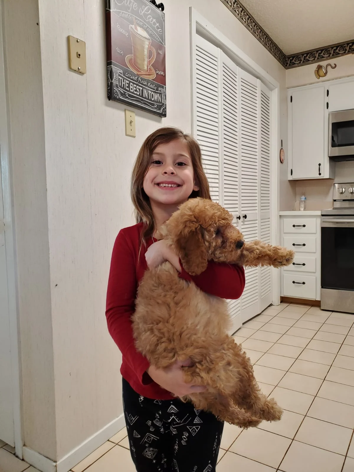 Small Child holding ehr new puppy
