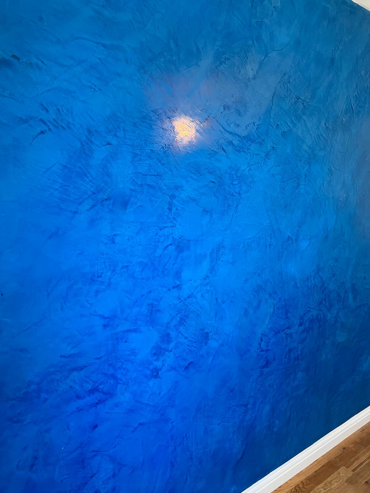 Professional plasterer applying external rendering to a house in Falkirk