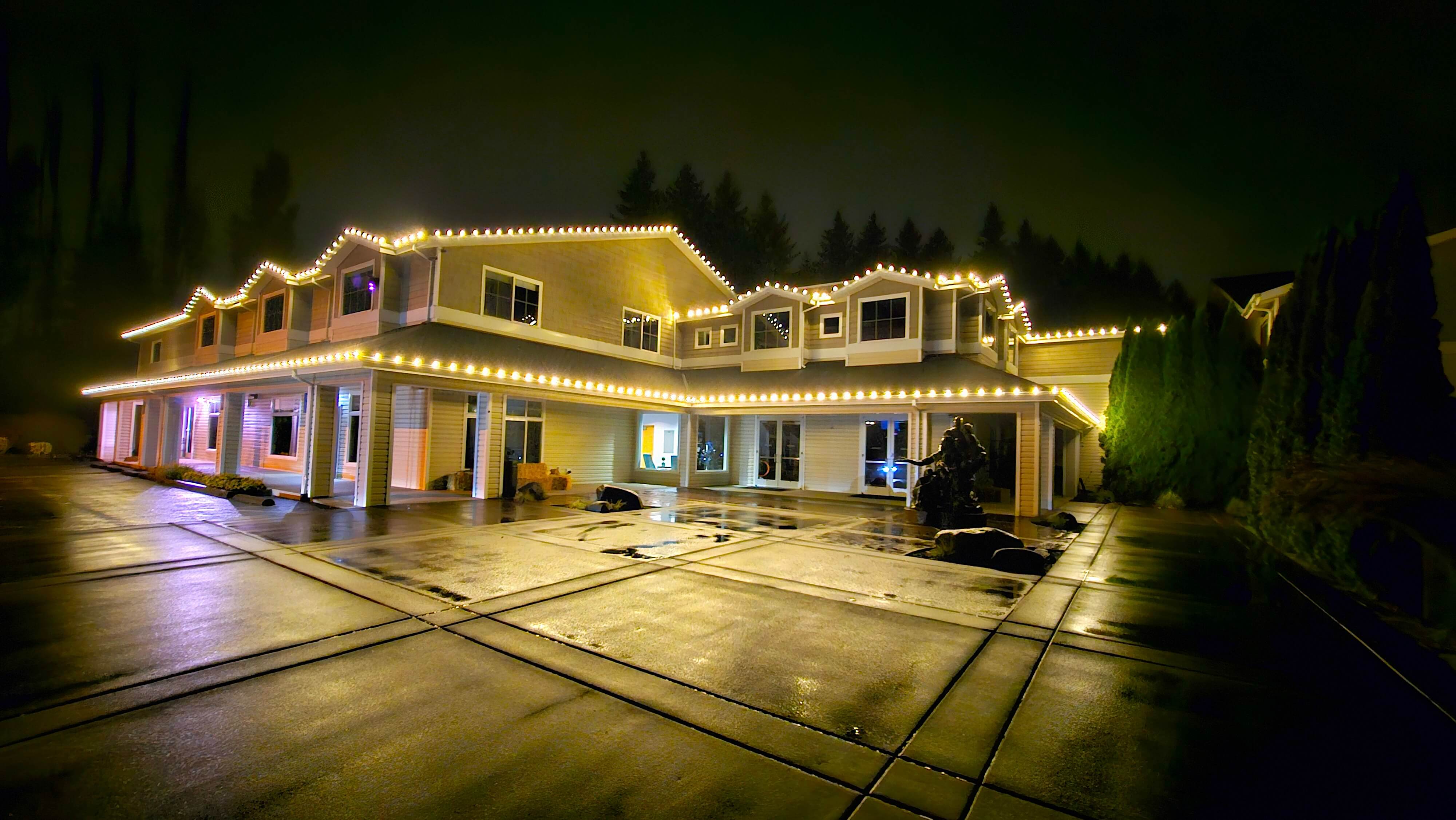 Warm white holiday lighting on Oregon home