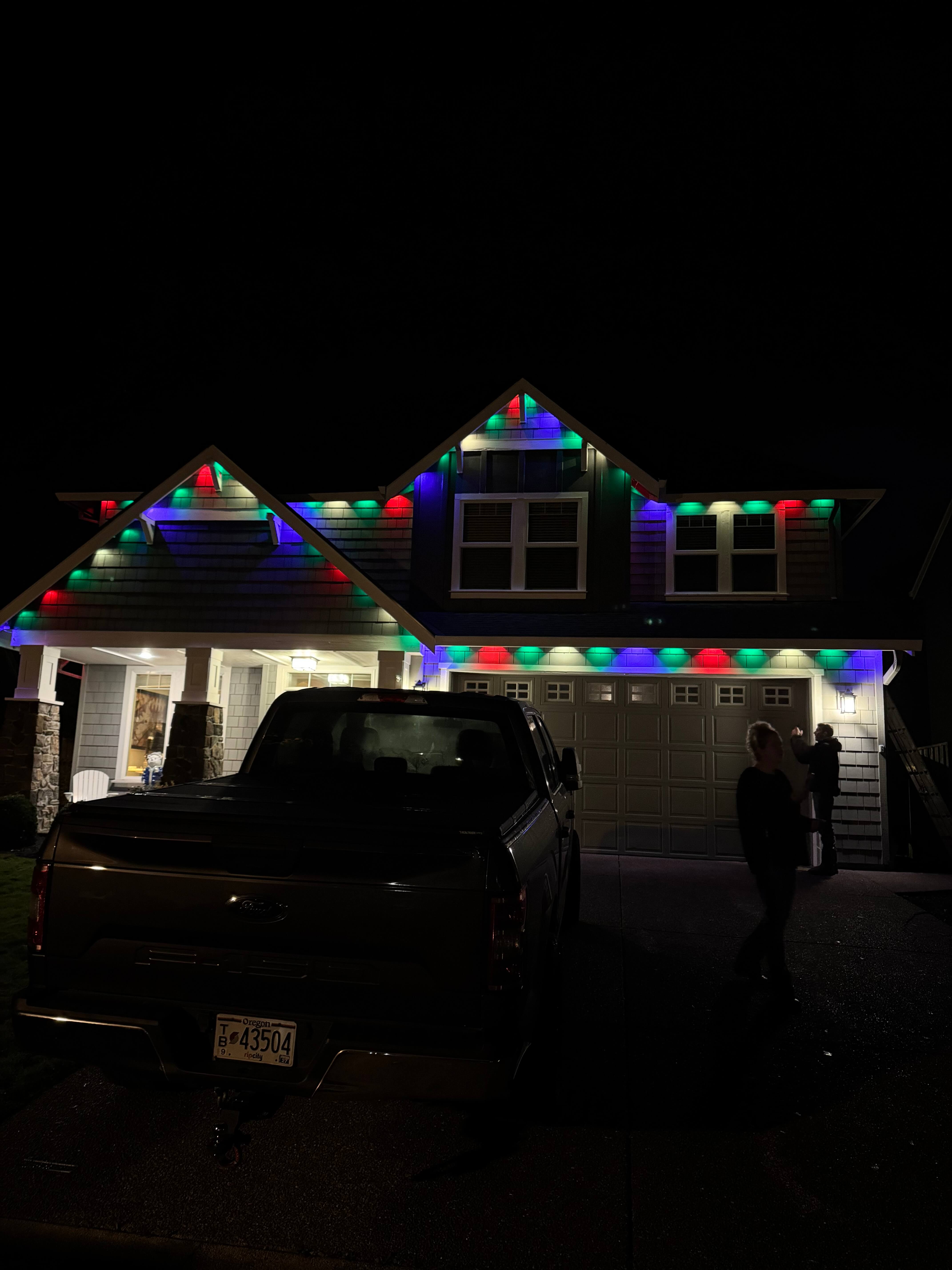 Permanent outdoor roofline lighting full color Oregon home