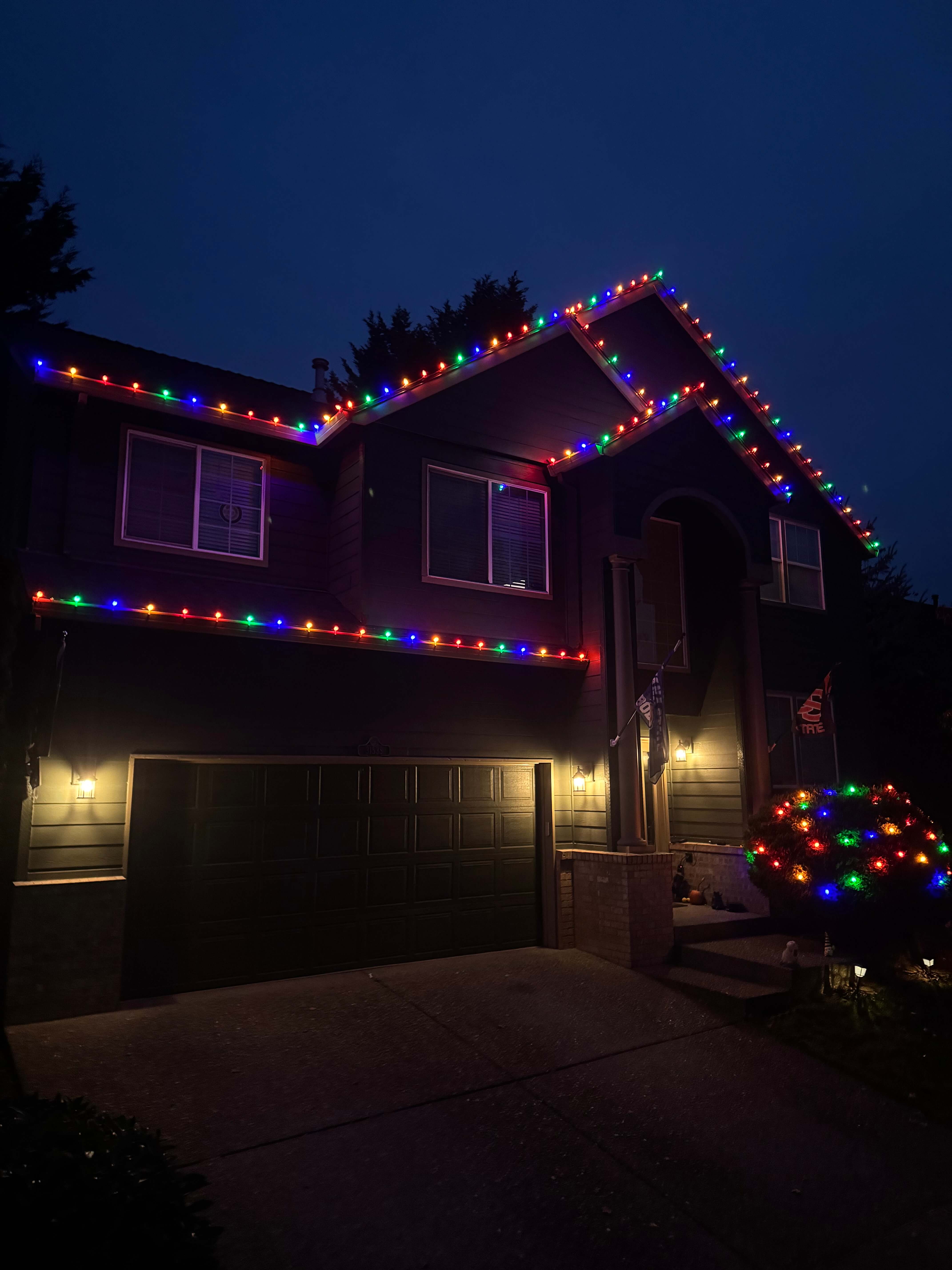 Multi color Christmas lights professionally installed on home exterior