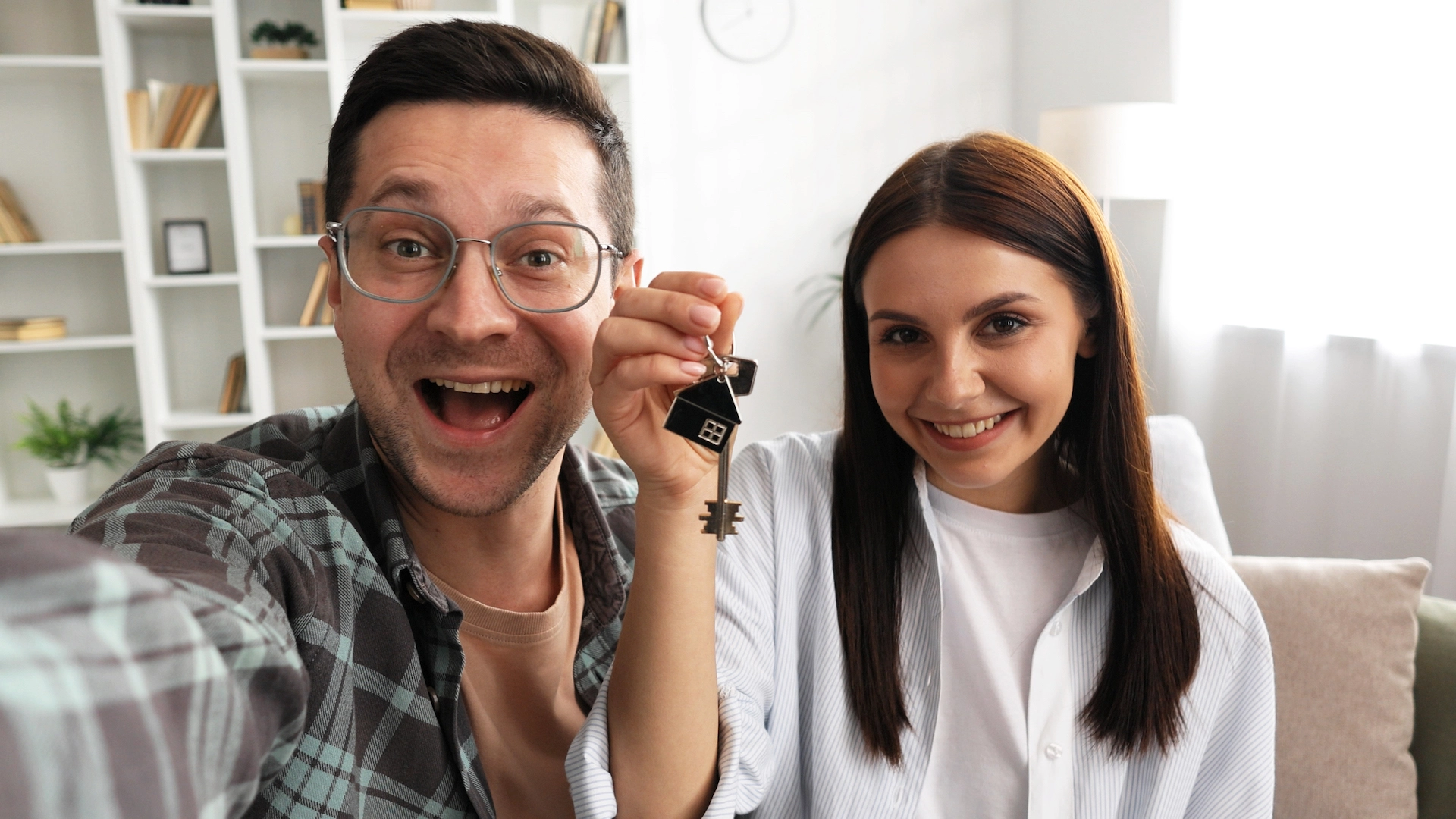 Happy couple with the keys to their new home.