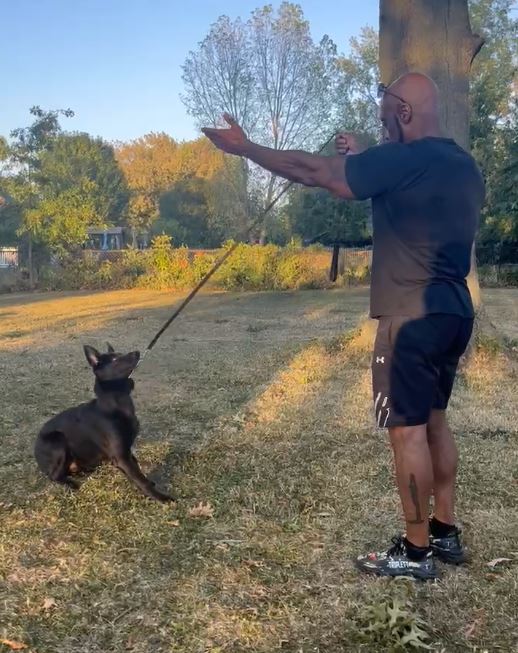 Eric Triplett training a dog outdoors