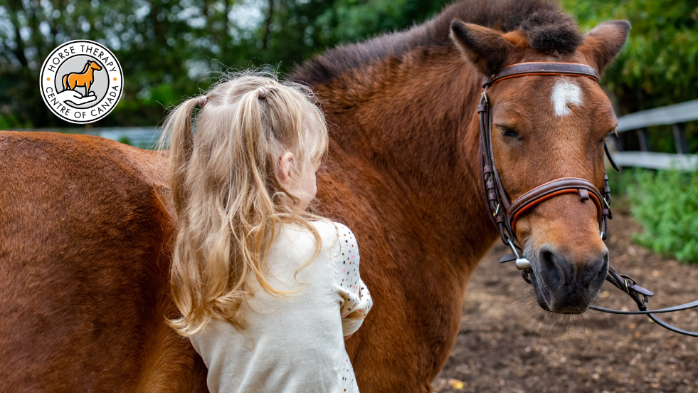Child hugging a horse during aba therapy for kids activity