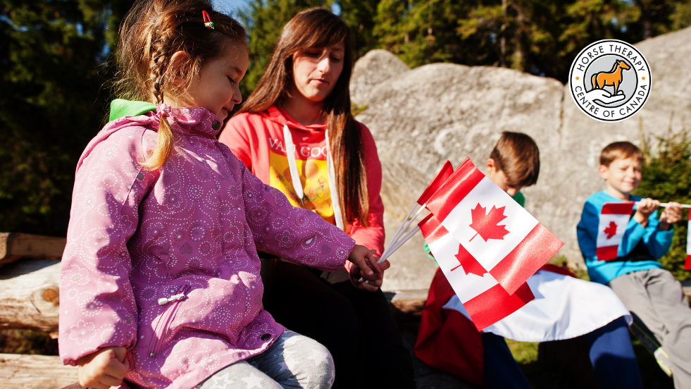 Children learning with a Canada map during therapy camp session Children learning with a Canada map during therapy camp session