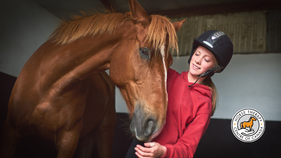 Woman caring for a horse during therapy with horses session