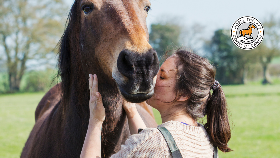 Woman bonding closely with a horse demonstrating equine therapy benefits Woman bonding closely with a horse demonstrating equine therapy benefits