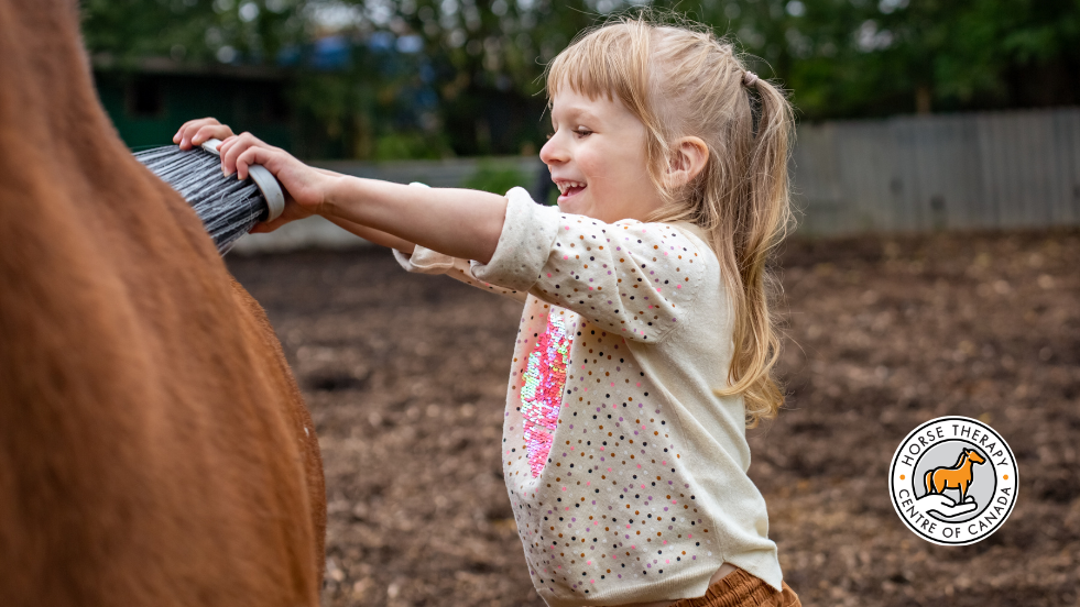 Child spraying water during aba activity focused on motor skills
