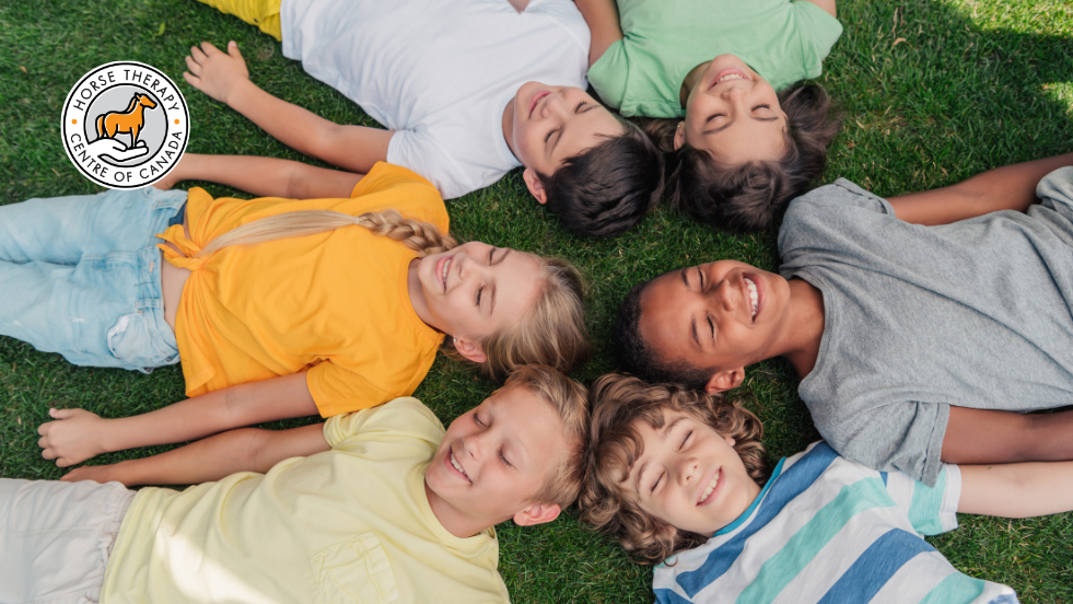 Group lying together and bonding during therapeutic camp activity Group lying together and bonding during therapeutic camp activity