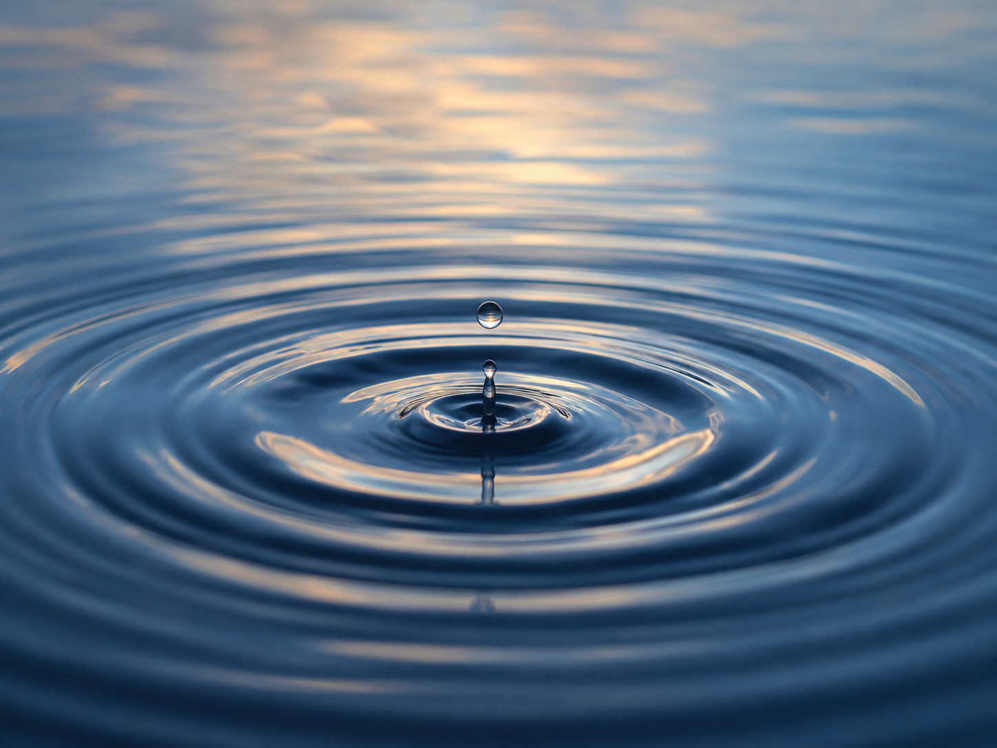 Water ripple symbolizing one action creating expanding impact