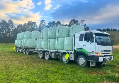 Tractor towing hay bayles