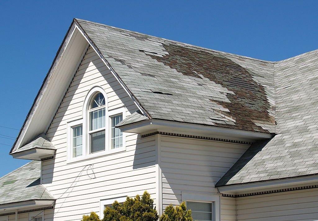 A worn shingle roof