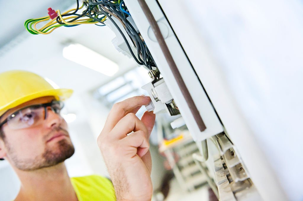 An electrician checking wiring