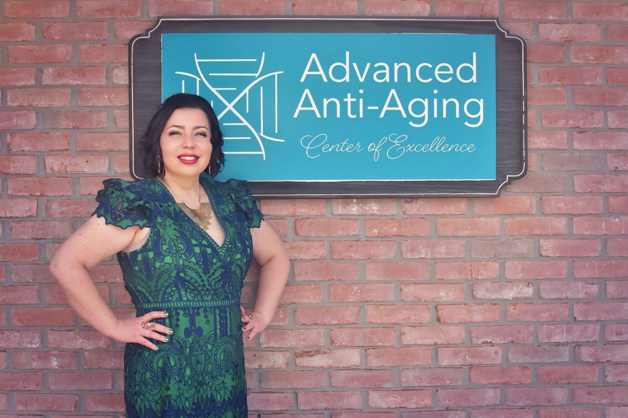 Irina Kochersperger, NP, founder of Advanced Anti-Aging Center of Excellence, in front of the Evansville office sign