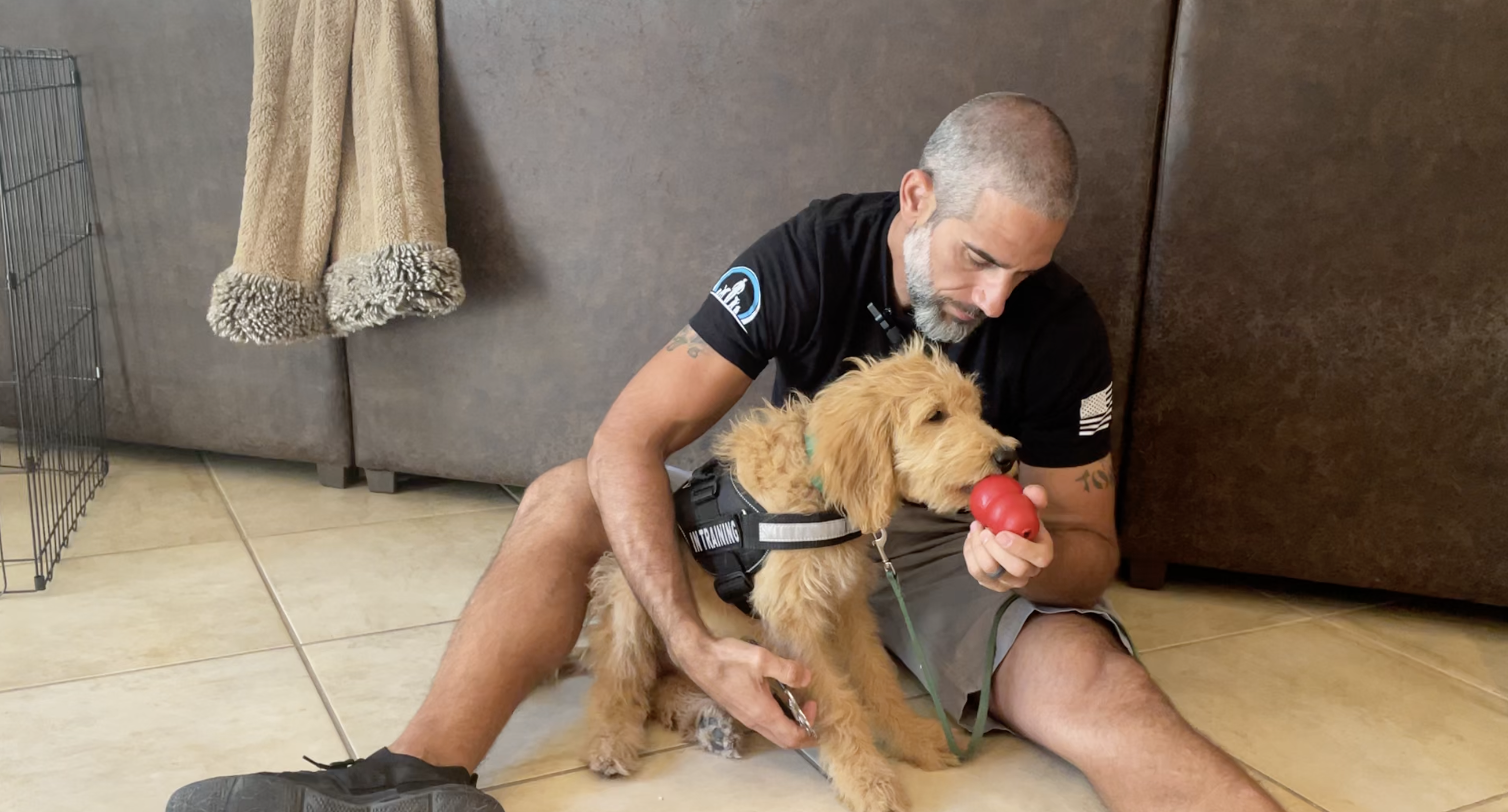 Antonio Diaz working with a puppy