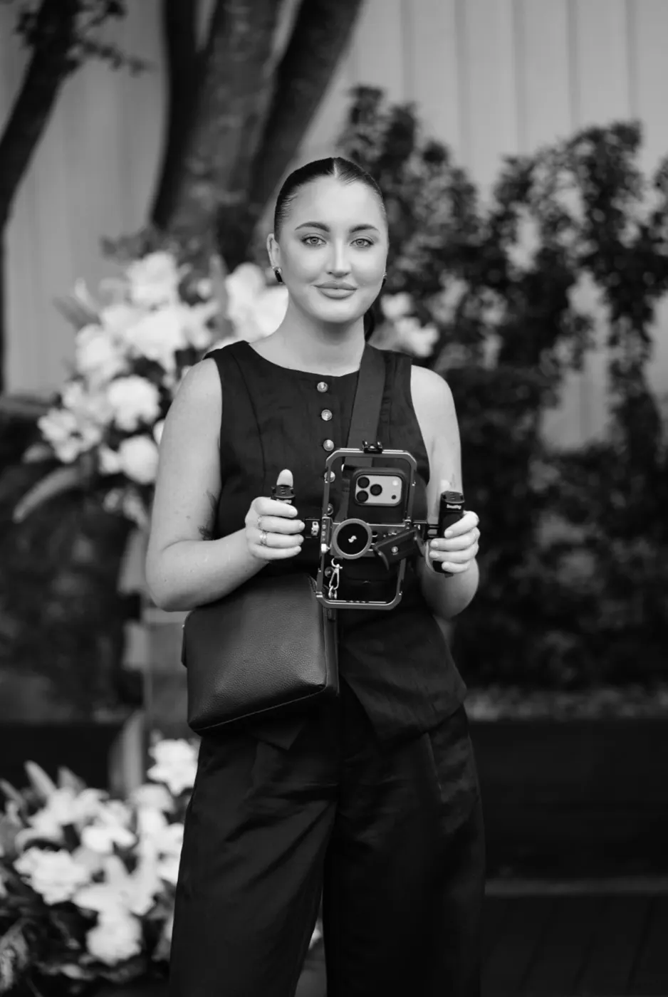 Kirsten, founder of Socials Only, holding her camera