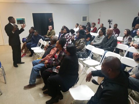 Tavares speaking to a community audience