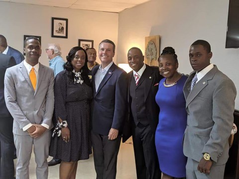 Tavares with community members at an event