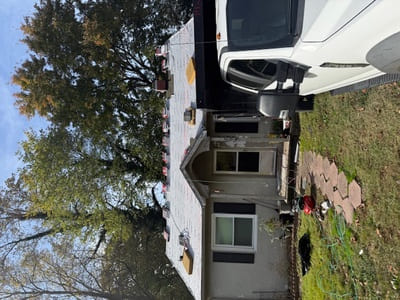 Old house during roof shingles restoration process