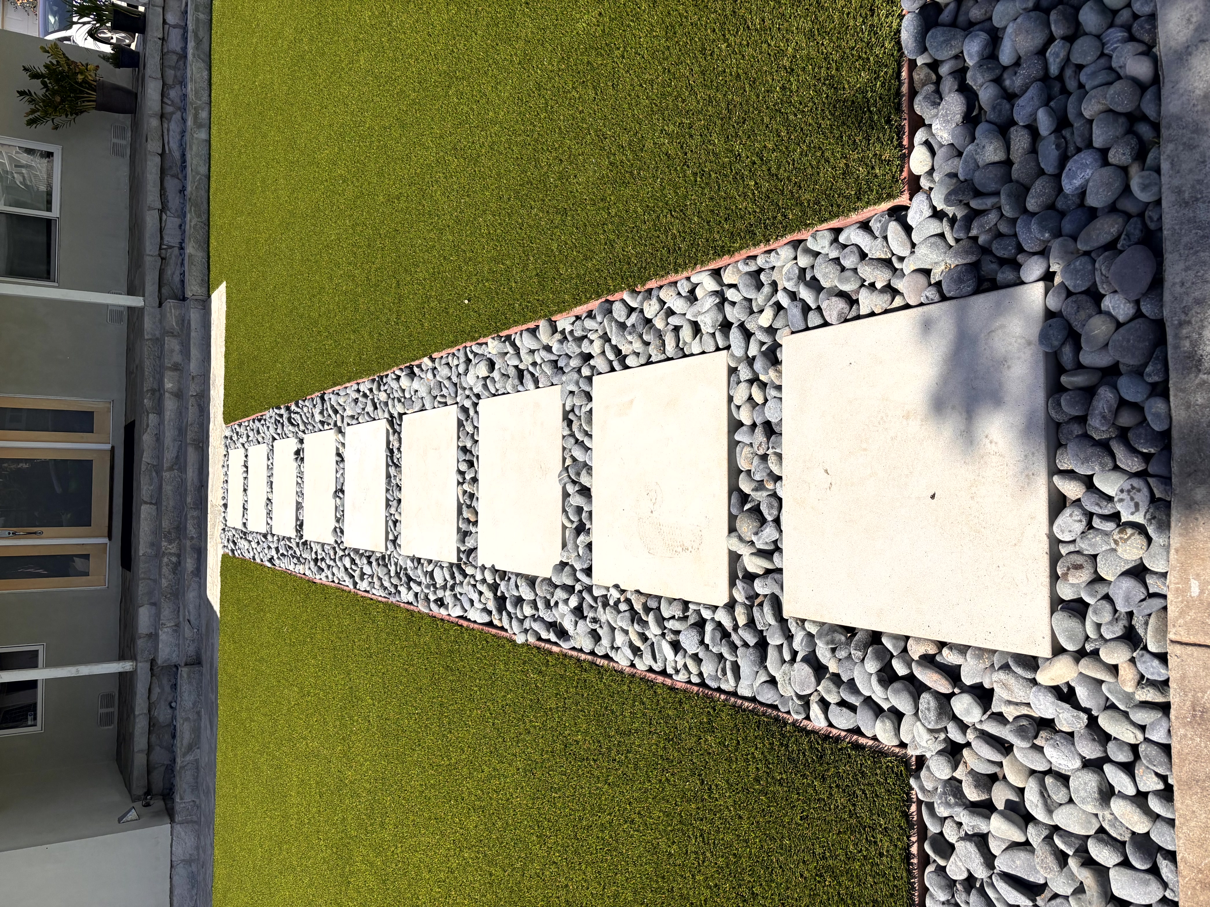 Apartment complex front area with artificial turf