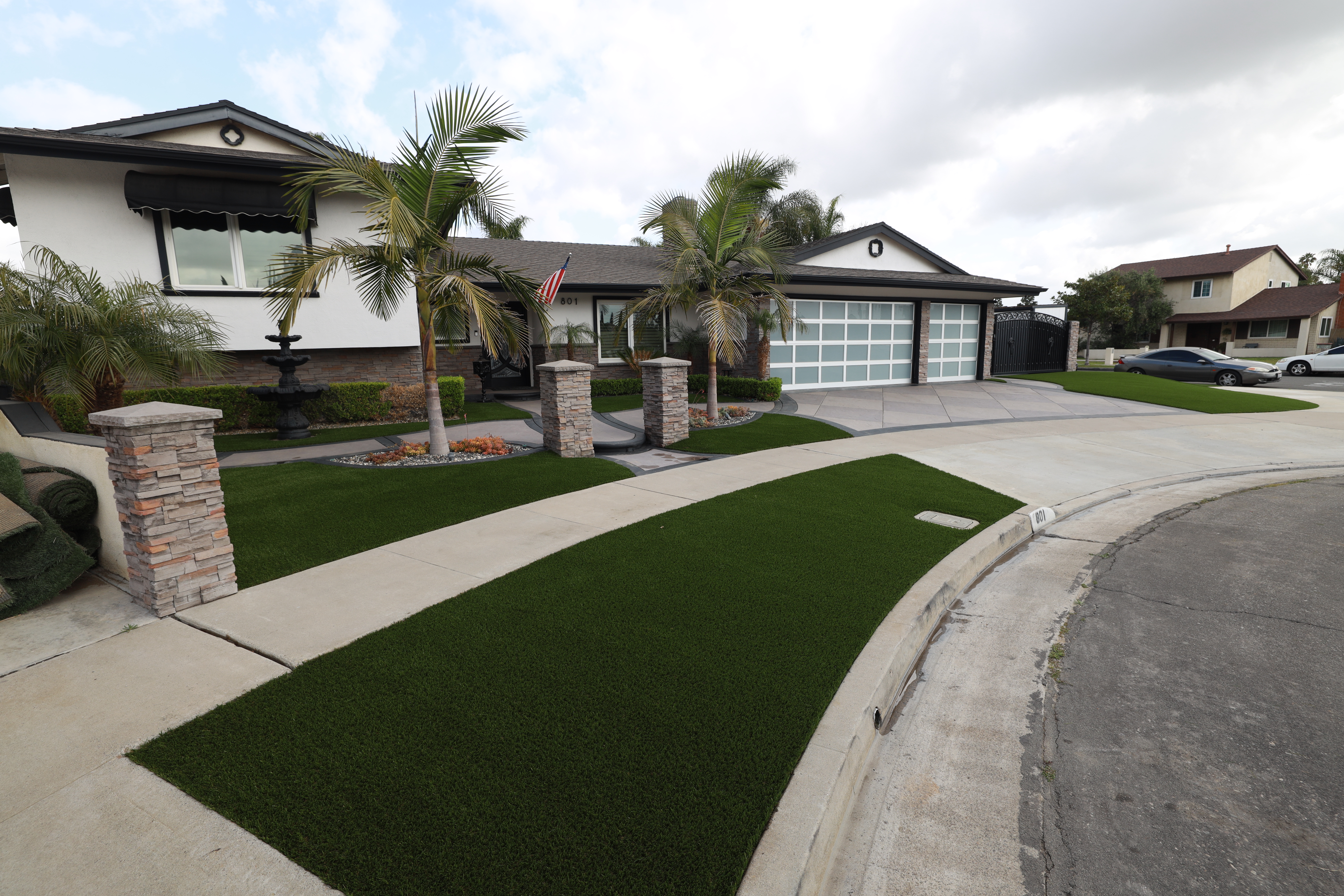 Aerial view of a beautiful front yard with artificial turf