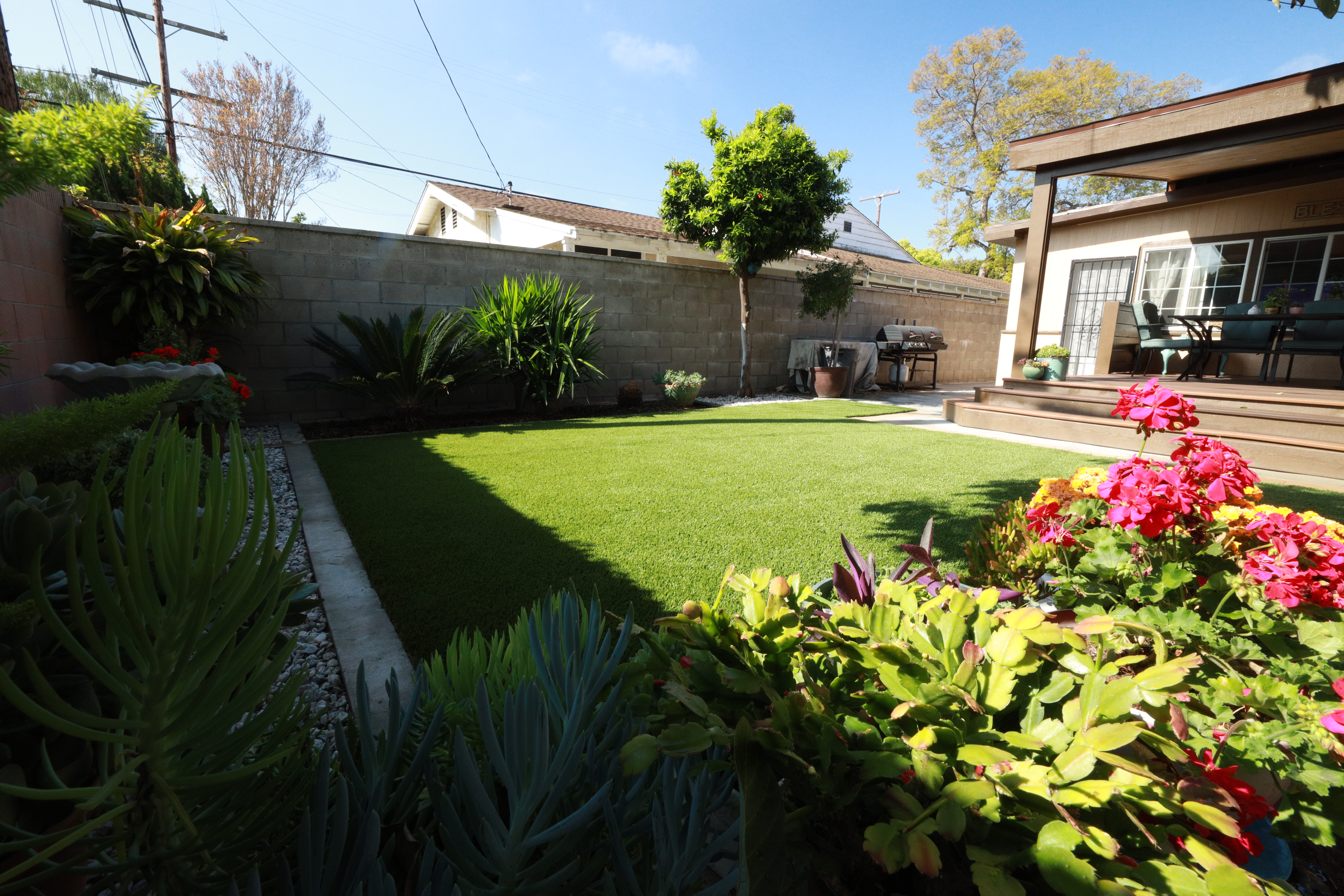 Residential backyard artificial turf installation