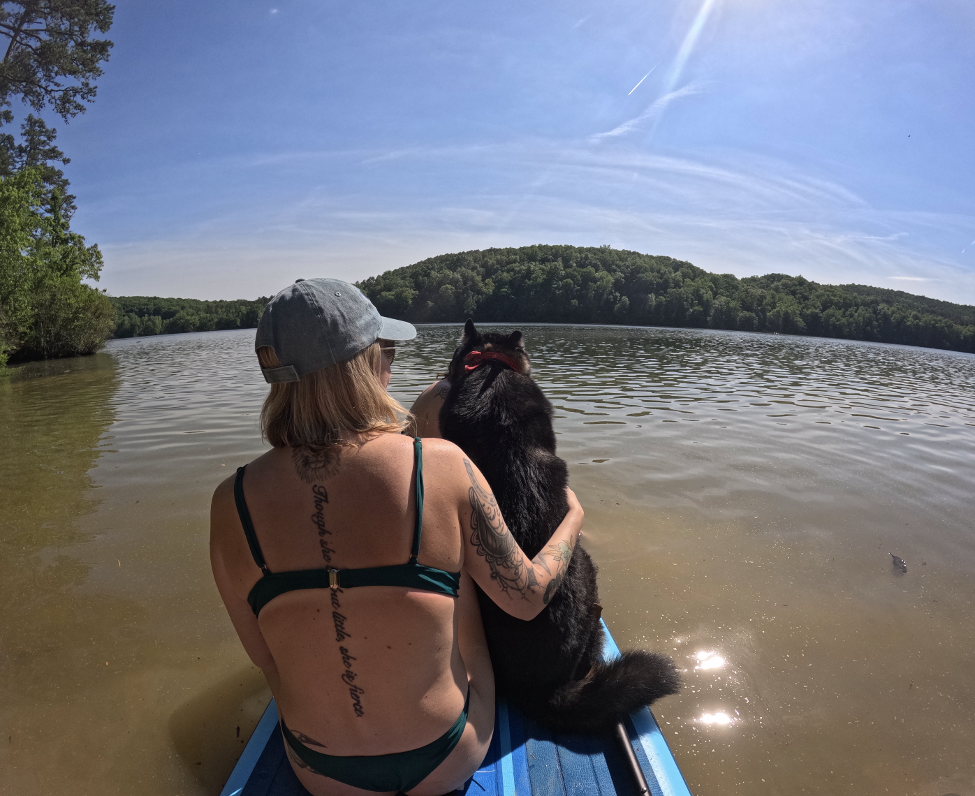 Gabby with her dog near the water
