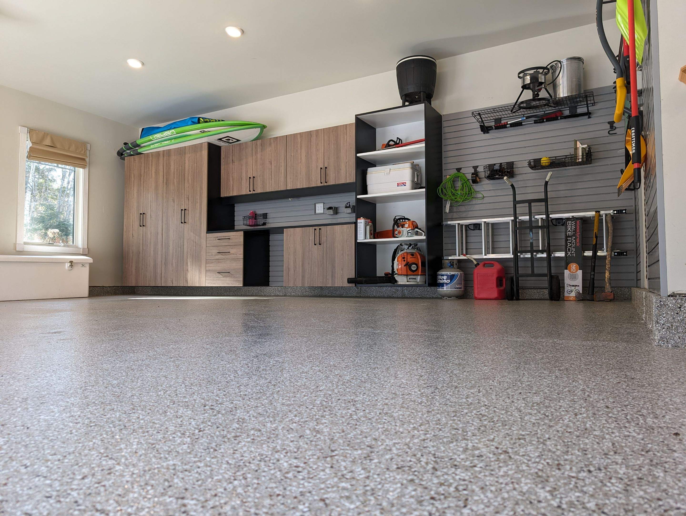 Custom PremierGarage cabinets, slatwall, and epoxy floor — Southern Maine