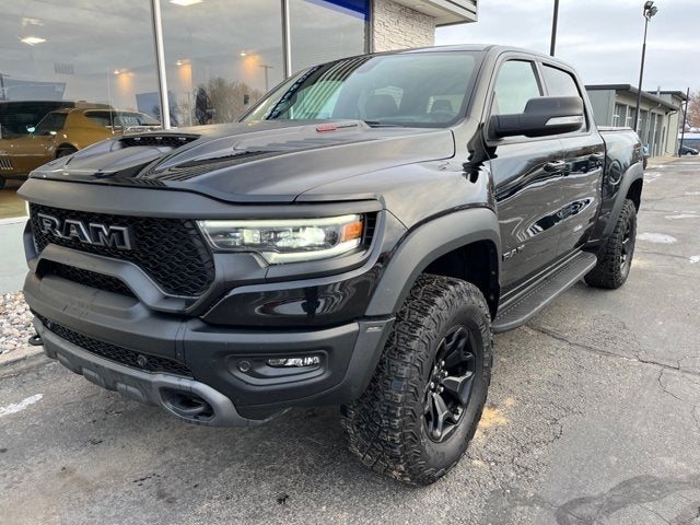 A black RAM 1500 TRX pickup on the Full Throttle lot