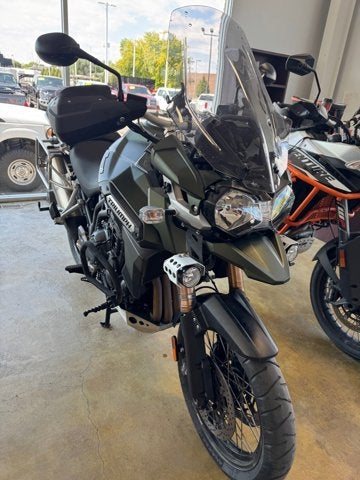 A Triumph Tiger motorcycle inside the Full Throttle showroom