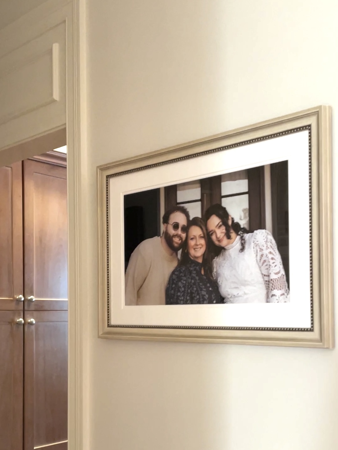family photo framed and on the wall