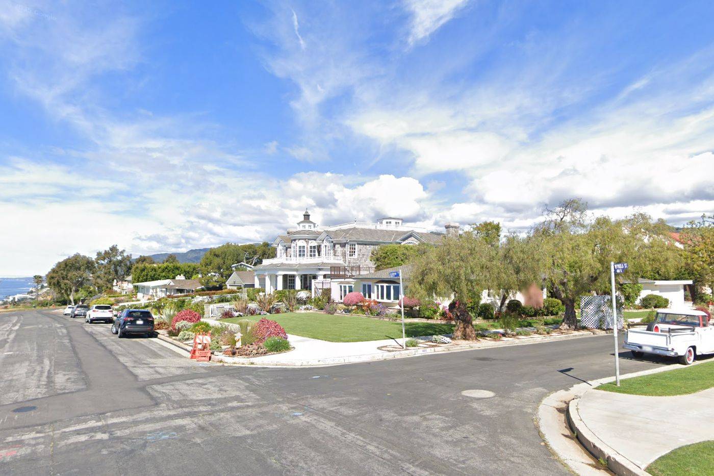 Google Street View of a burned Palisades corner lot before the fire, April 2019