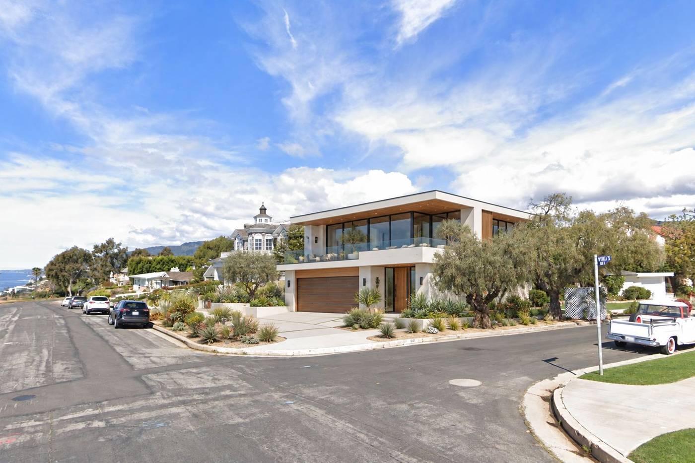 The same street view with an AI concept of a new two-story home
