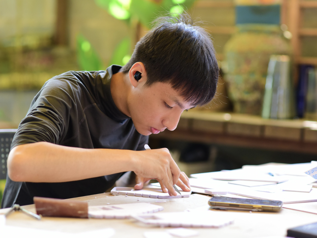 a teenager doing his assignment a teenager doing his assignment
