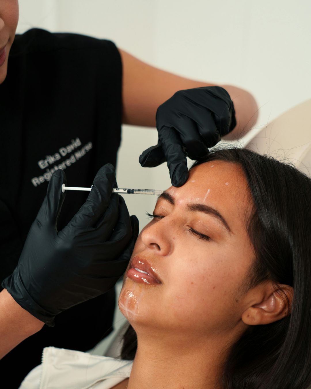 Practitioner performing a quick Botox Express treatment at Merlan Salon, Boutique and Spa