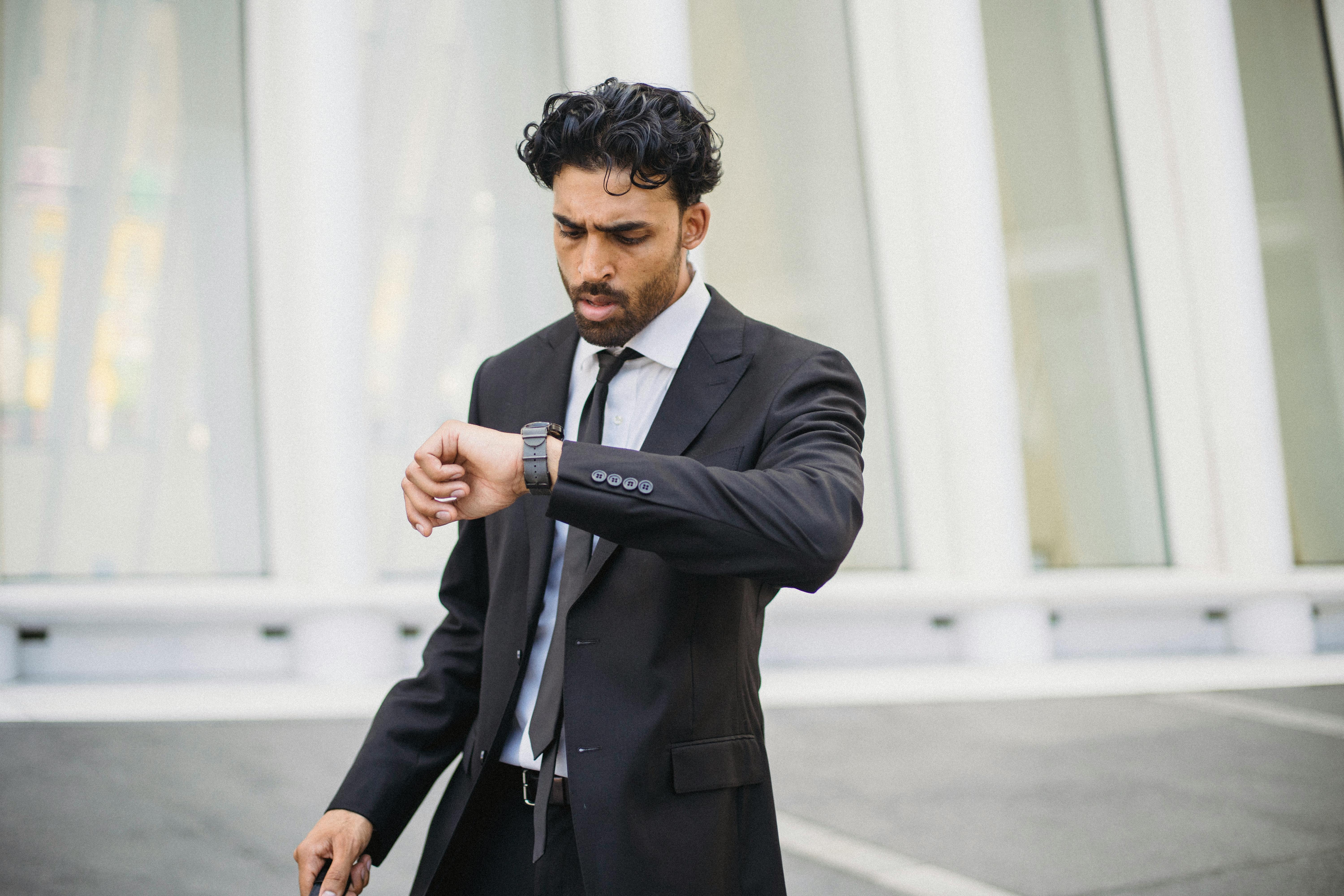 businessman looking at his watch