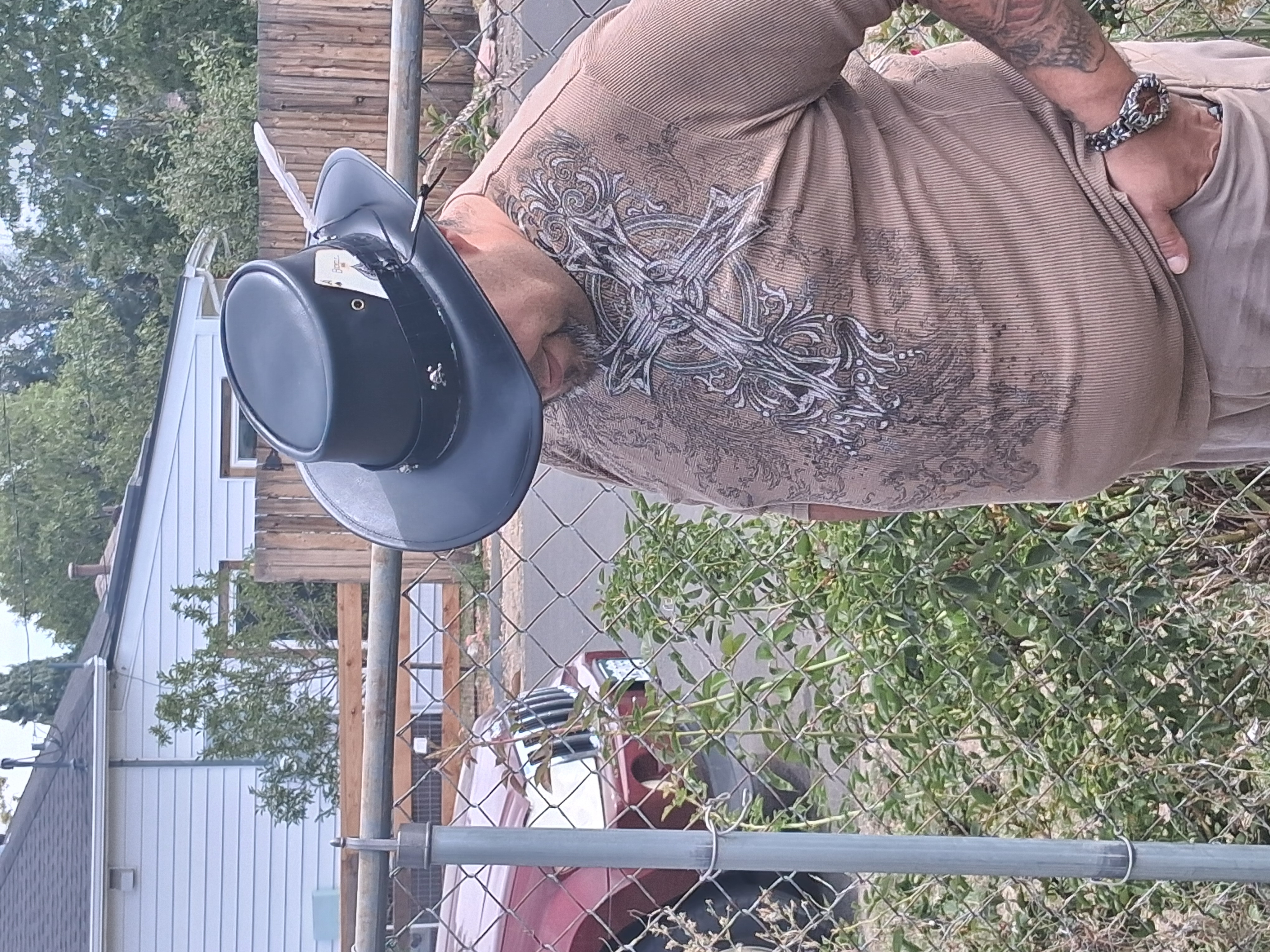 Custom black leather top hat with feather, by Ace of Spadez