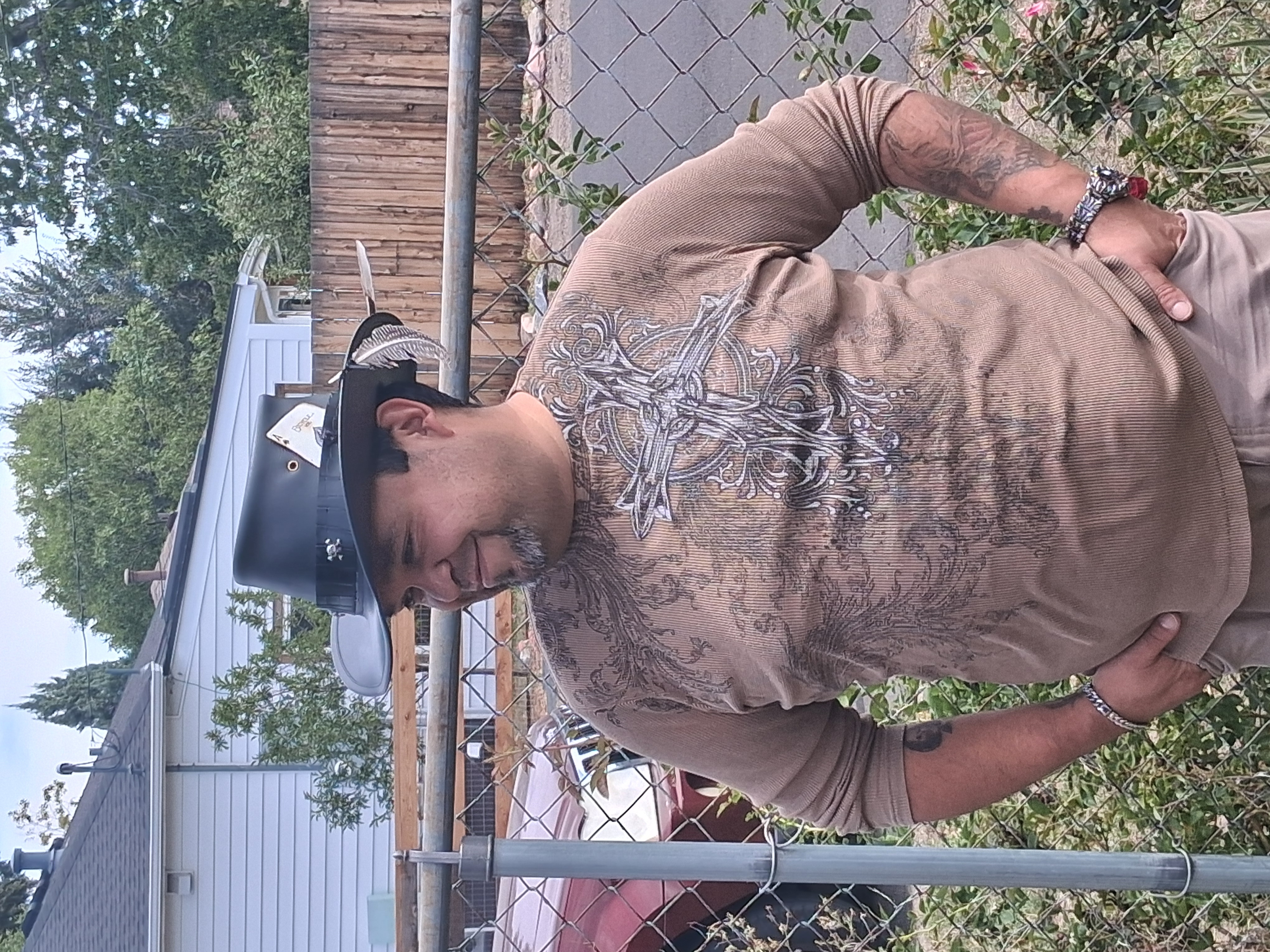 Custom black leather flat-crown hat with feather, by Ace of Spadez