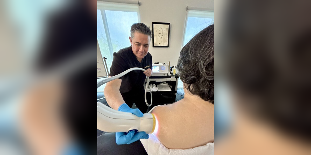 Dr. Colgin applying SoftWave shockwave therapy to patient shoulder, non-invasive pain relief treatment Optimal Health Members Henderson NV Dr. Colgin applying SoftWave shockwave therapy to patient shoulder, non-invasive pain relief treatment Optimal Health Members Henderson NV