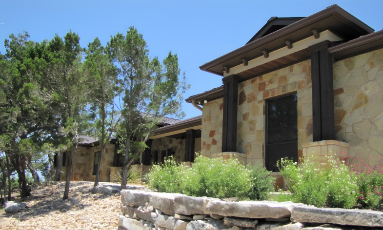 Hill Country stone home served by Competition A/C & Heat in San Marcos, Texas