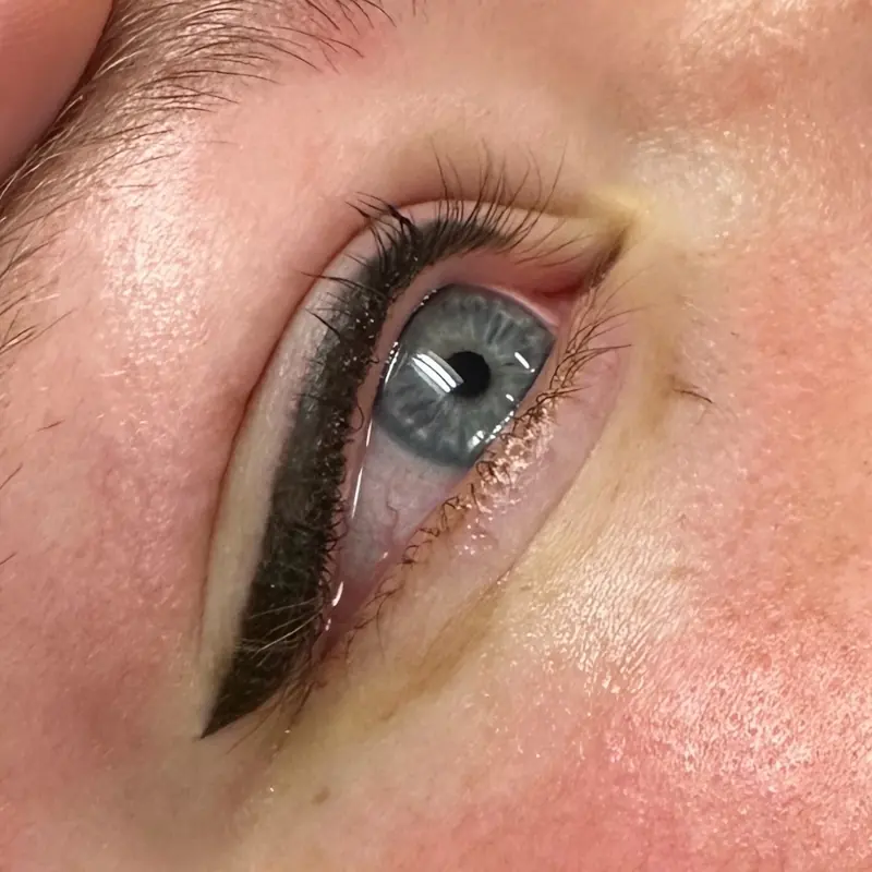 Close-up of a defined eyeliner wing along a client's upper lash line