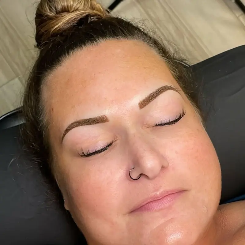 Client relaxing after brows with a soft, natural finish