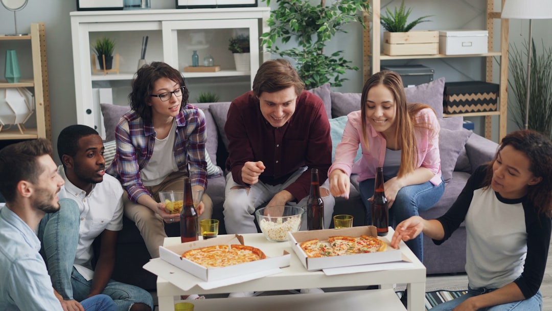 Family at coffee table excited about finances 
