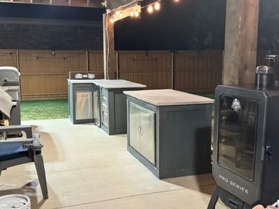 Modern outdoor kitchen featuring custom countertops