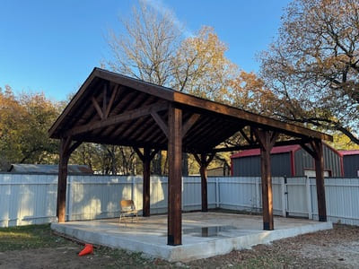 Custom-built wooden pavilion in an open yard