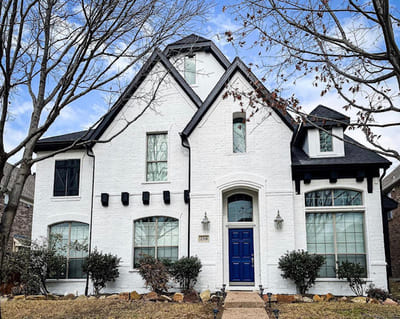 Classic white home exterior with modern black accents