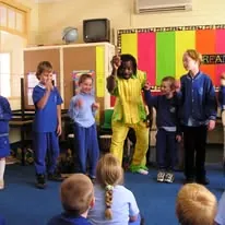 African Beat performers with young students in a primary school classroom